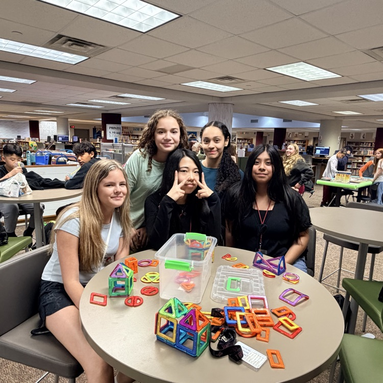 students building with magnatiles 