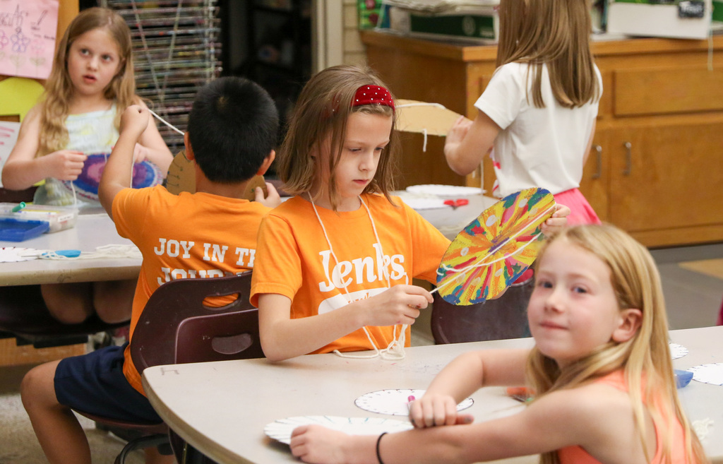 Student focused on her circle weave.