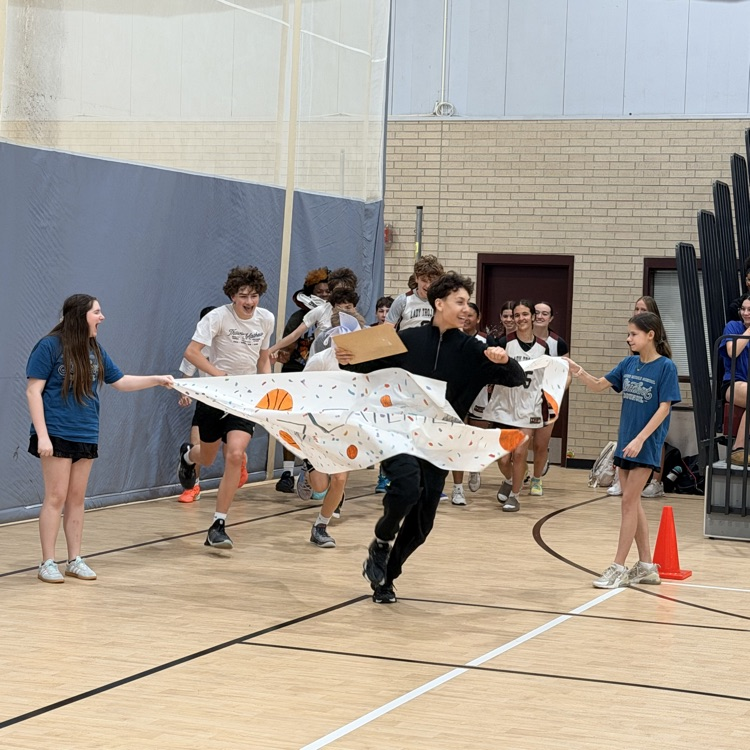 students running through banner