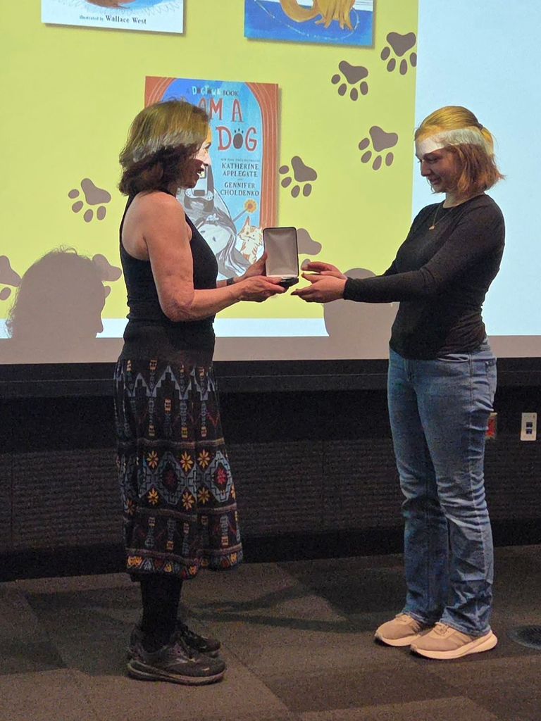 JWI Student presenting the award to the author during the field trip.