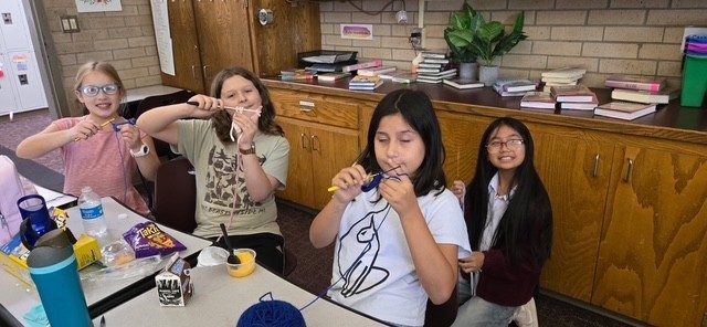 students at the crochet lunch club