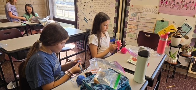 students at the crochet lunch club