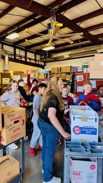 5th grade class food drive winner at the Jenks food bank