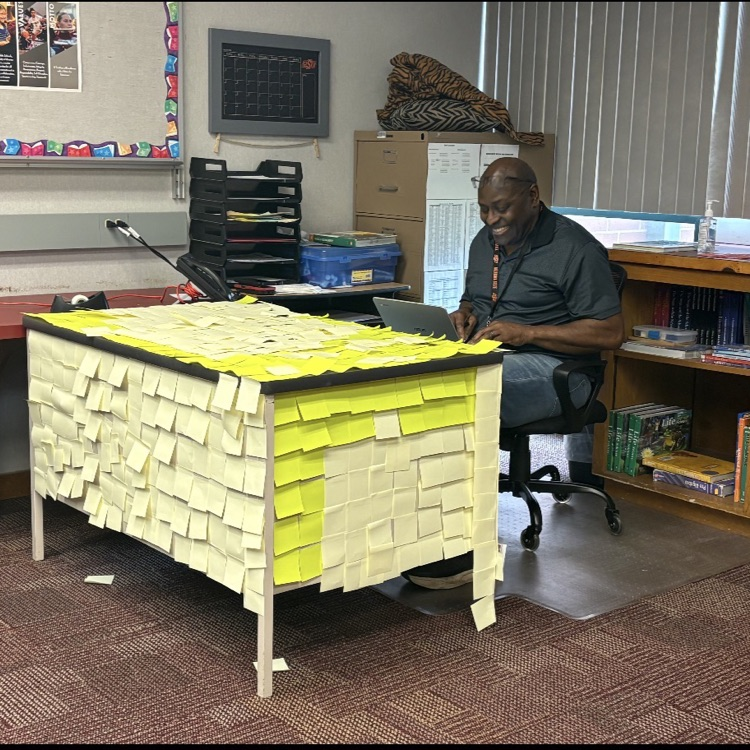 desk covered by post it notes 