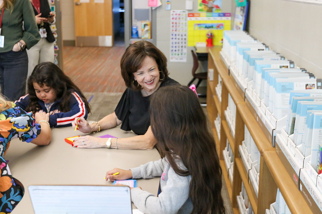 Dr. Butterfield smiling at a student.