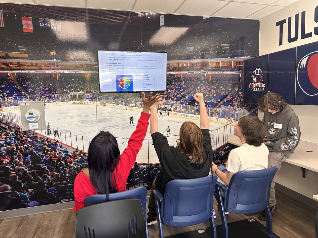 Students watching a hockey game 