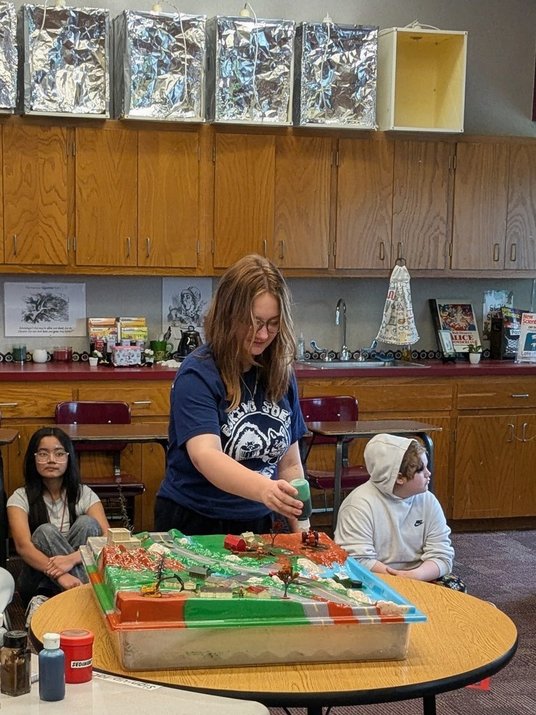 student working with a science experiment
