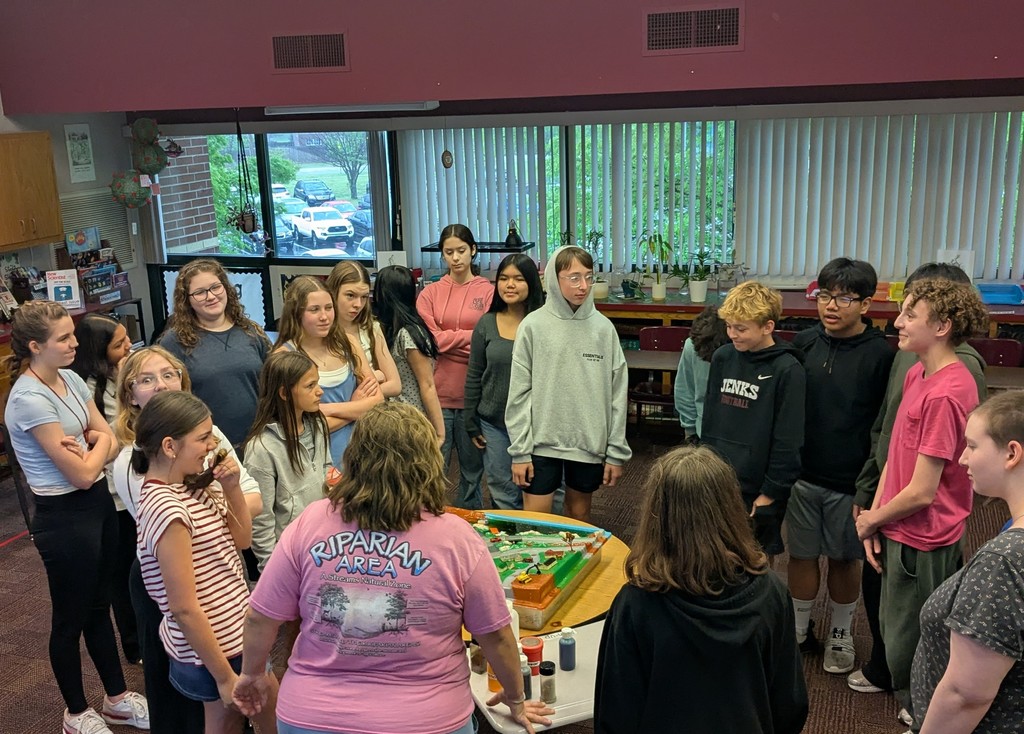 students gathered around a demonstration