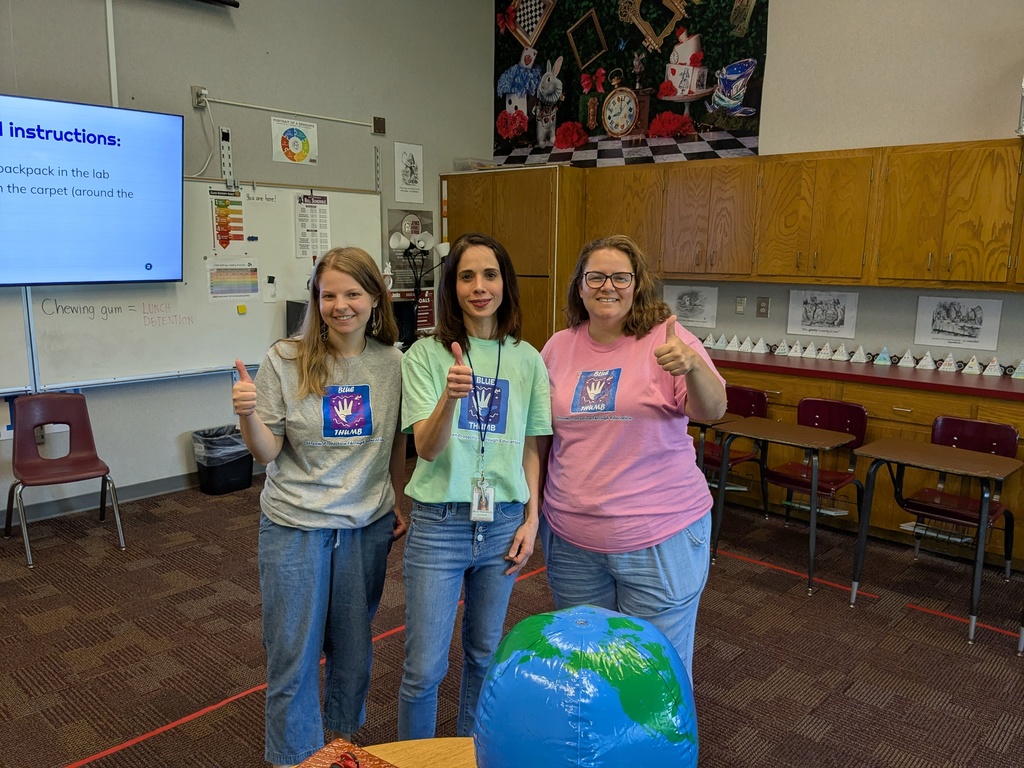 3 adults giving "thumbs up"