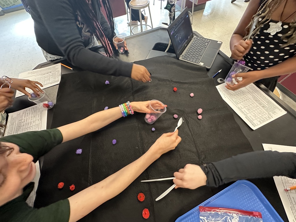 student hands doing experiment