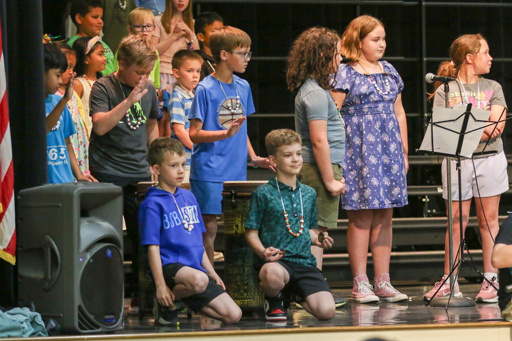 boys drumming and using instruments.