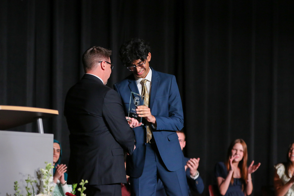 Sahil receiving his award from principal David Beiler