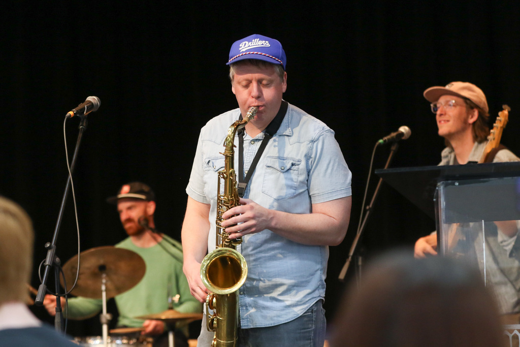 Member of the band playing his saxophone.