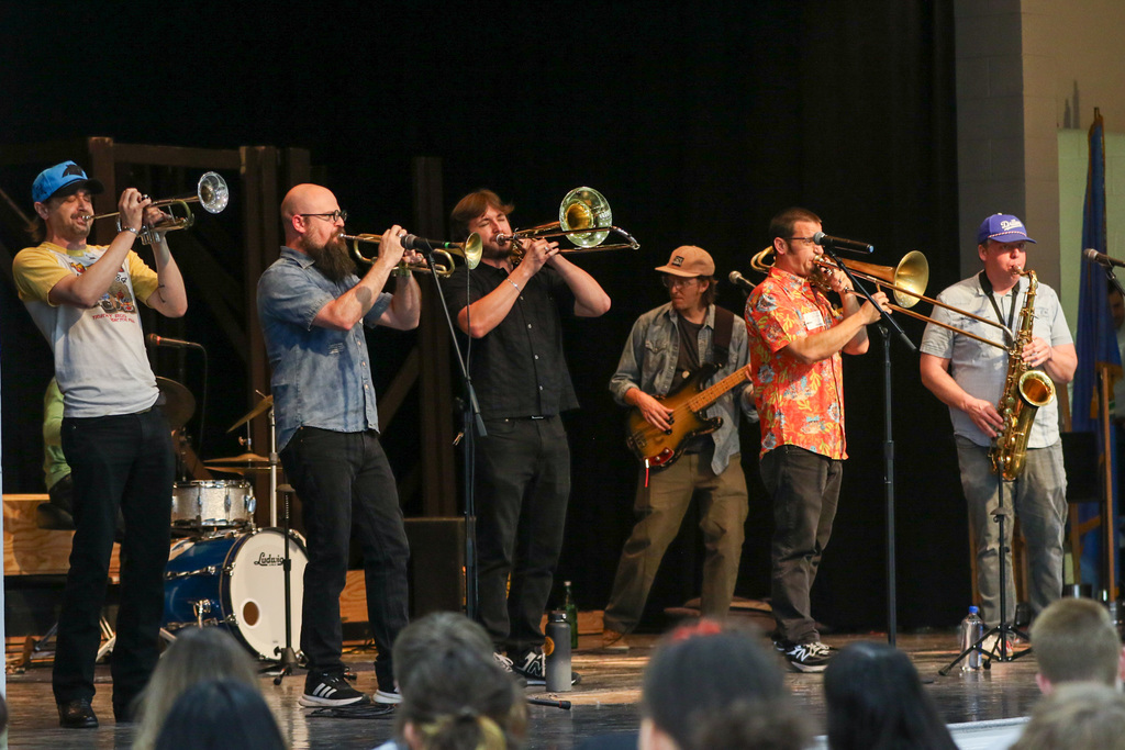 King Cabbage Brass Band on stage playing their instruments.