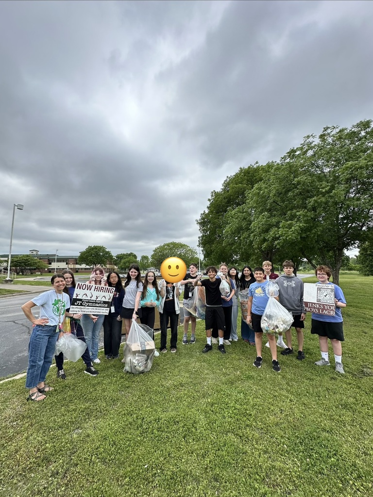 Mrs. Swift and students picking up trash