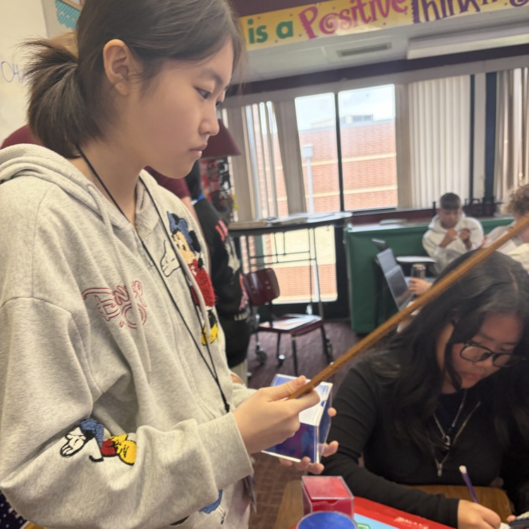 students measuring 