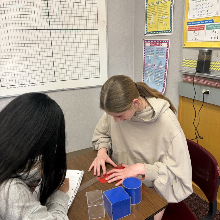 students measuring 