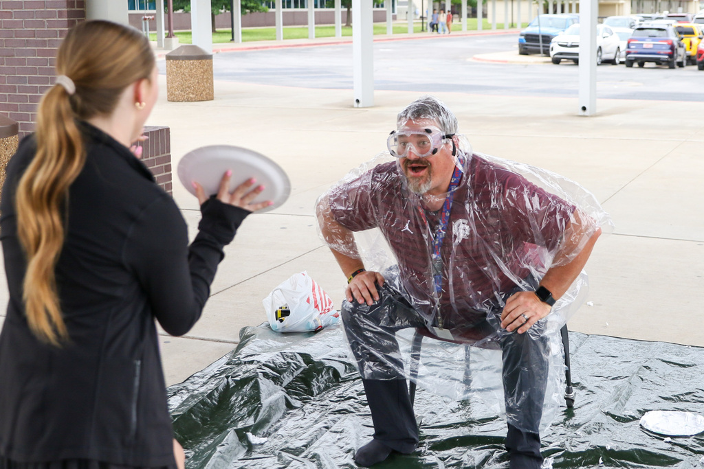 coach able preparing to take a pie to the face with a smile