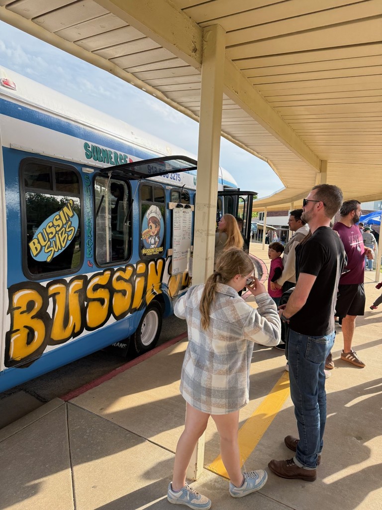 families at the food trucks at the celebration of learning