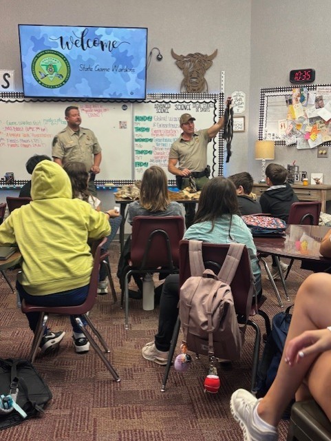 students listening to a presentation 
