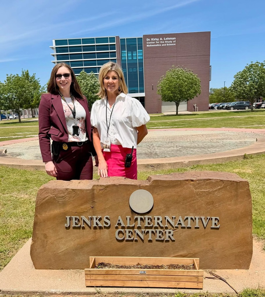 a photo of two women next to JAC sign
