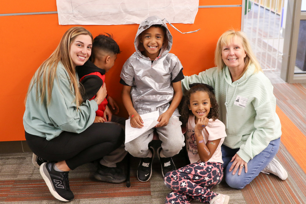 family with boy dressed a sliver bug