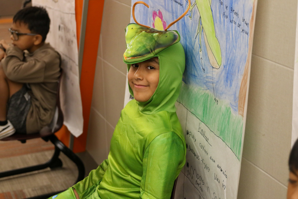boy in a pray mantis costume 