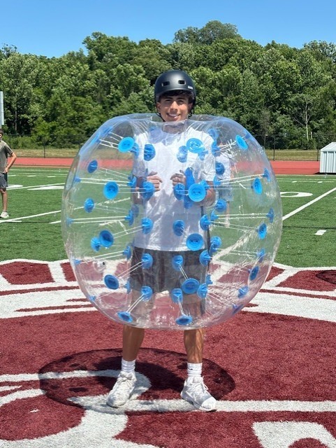 student in inflatable soccer game