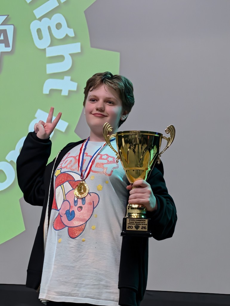 boy holding trophy