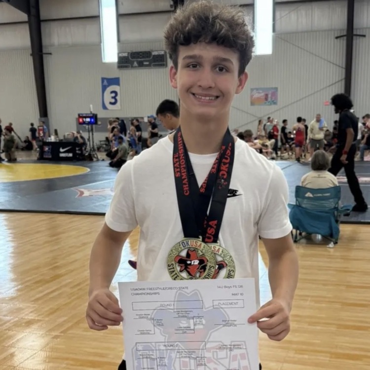 wrestler with medals and certificate 