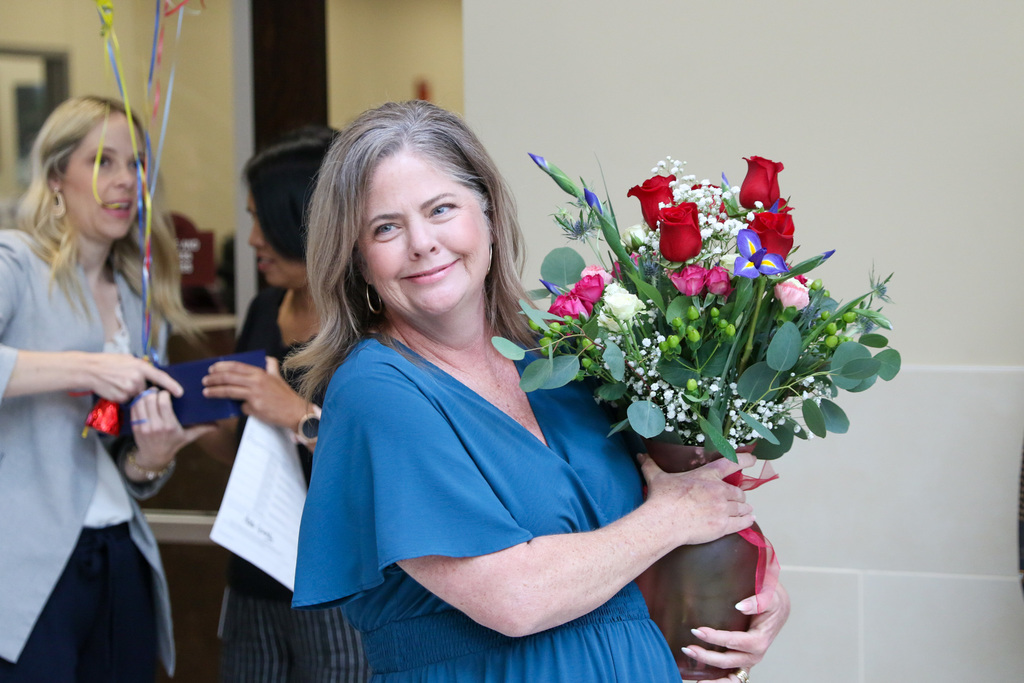 jaime holding a big bouquet of flowers