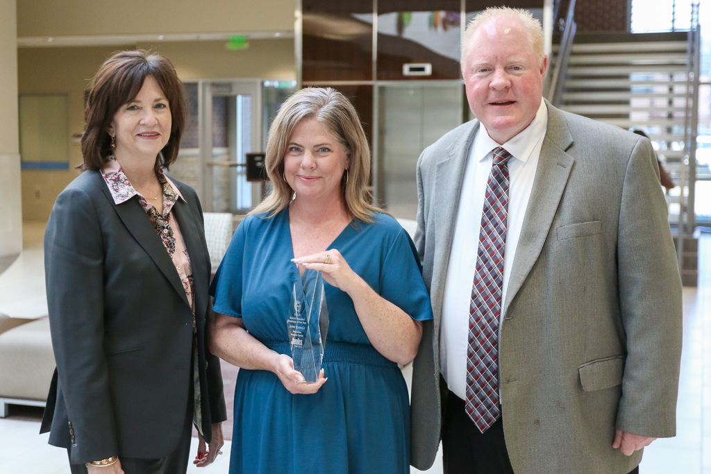 dr. butterfield, jaime resendiz, and cody way in the ESC lobby posing for a photo