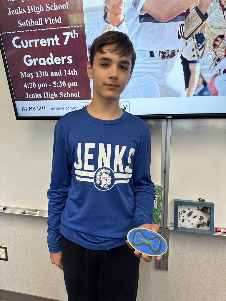 student holding  artifact