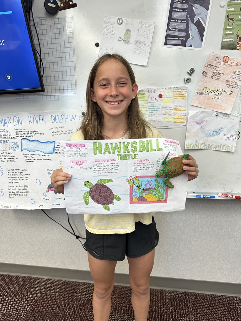 student holding poster