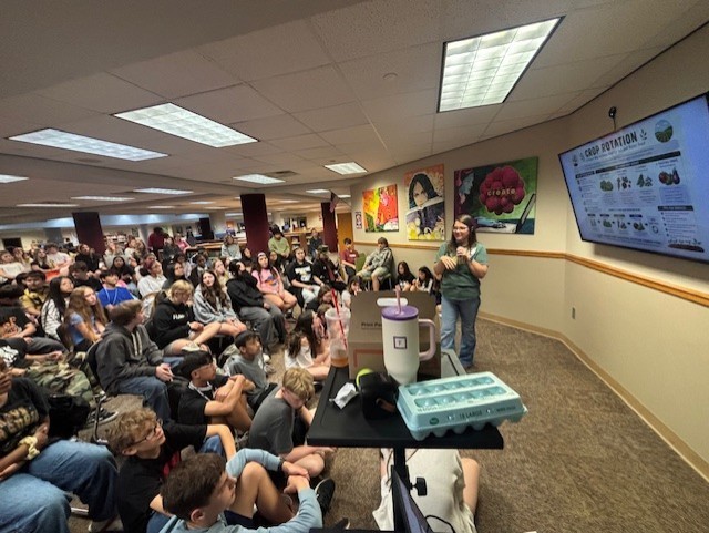 presenter talking to students