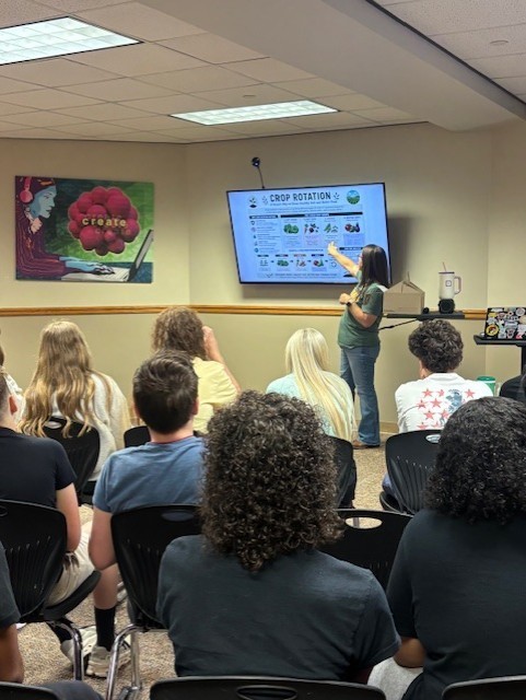 presenter talking to students