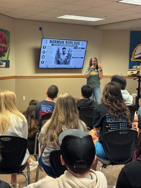 presenter talking to students