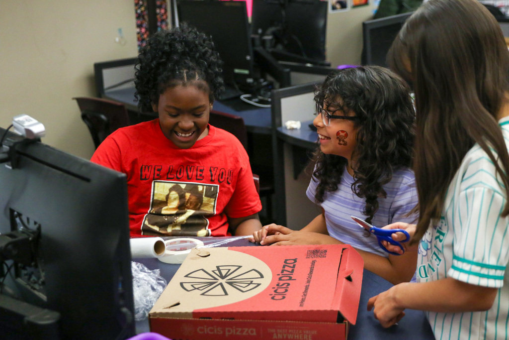 girls doing a stem experiment