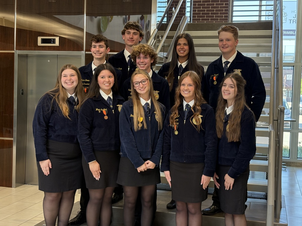 Group of 10 Jenks High School FFA members posing on staircase after being recognized by JPS Board of Education