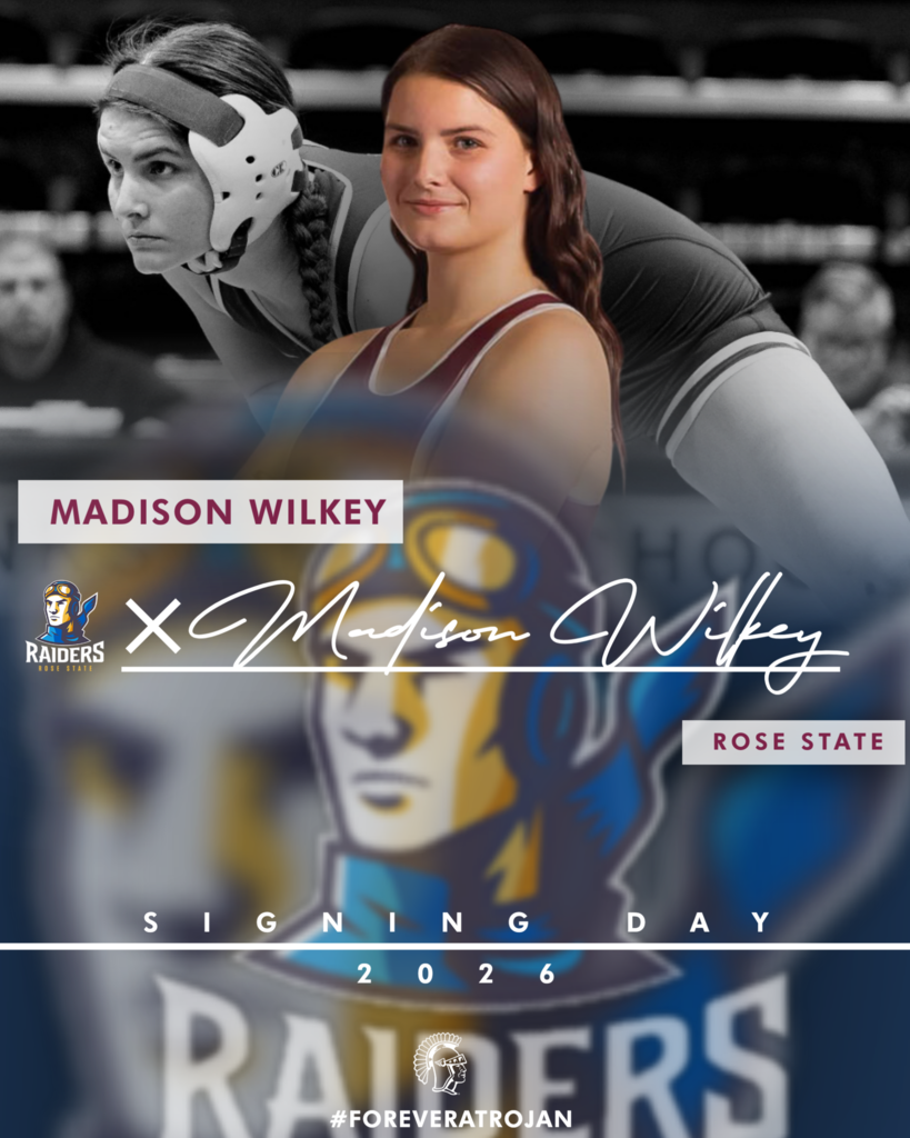 Graphic announcing college signing day for student-athlete Madison Wilkey. Centered in the image is a smiling student in a Jenks Trojans cheer uniform, shown in full color in a celebratory, upright pose. The background features a black-and-white stadium scene with fellow cheerleaders in the bleachers holding pom-poms, creating a layered, high-energy athletic atmosphere. Large text near the top displays “Madison Wilkey.” Across the center is the Rose State College logo alongside a stylized signature version of the student’s name. A banner beneath reads “Rose State College.” Near the bottom, bold text reads “Signing Day 2026,” followed by the hashtag “#ForeverATrojan” and a Trojan helmet icon. The design incorporates Jenks maroon and white accents paired with Rose State branding.