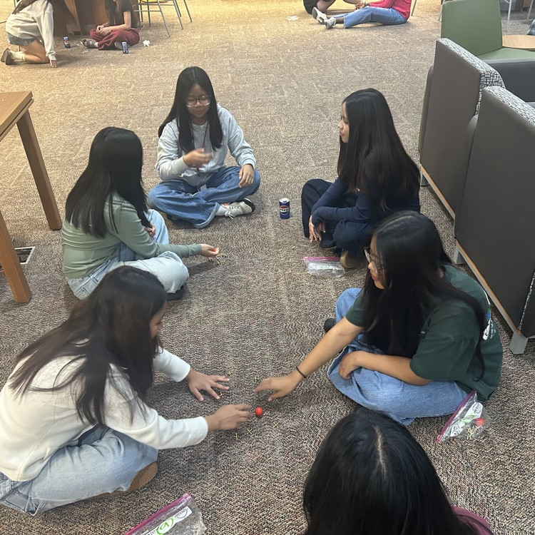 students playing jacks 