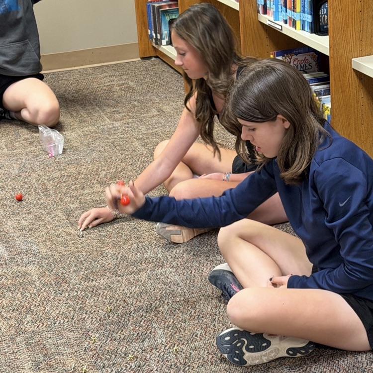 students playing jacks 