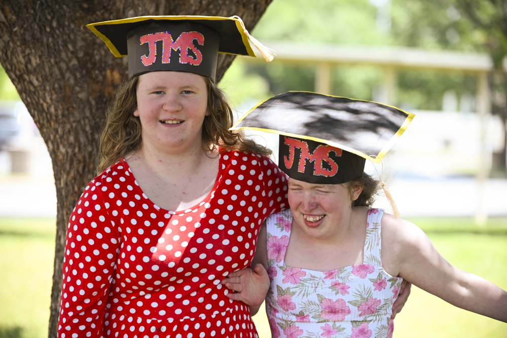 Students in JMS graduation cap