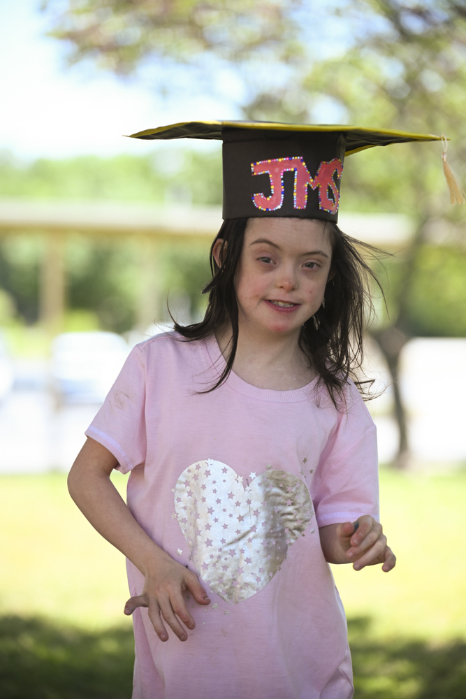 Student in JMS graduation cap