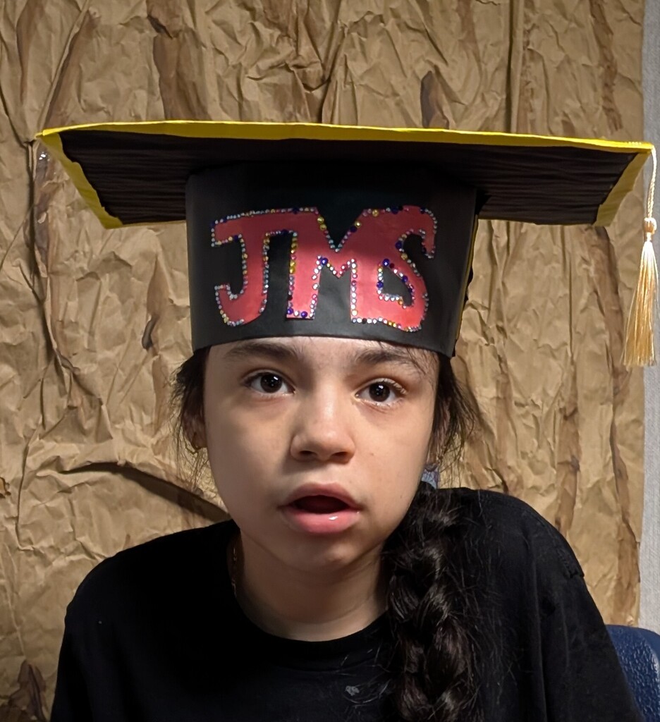 Student in JMS graduation cap