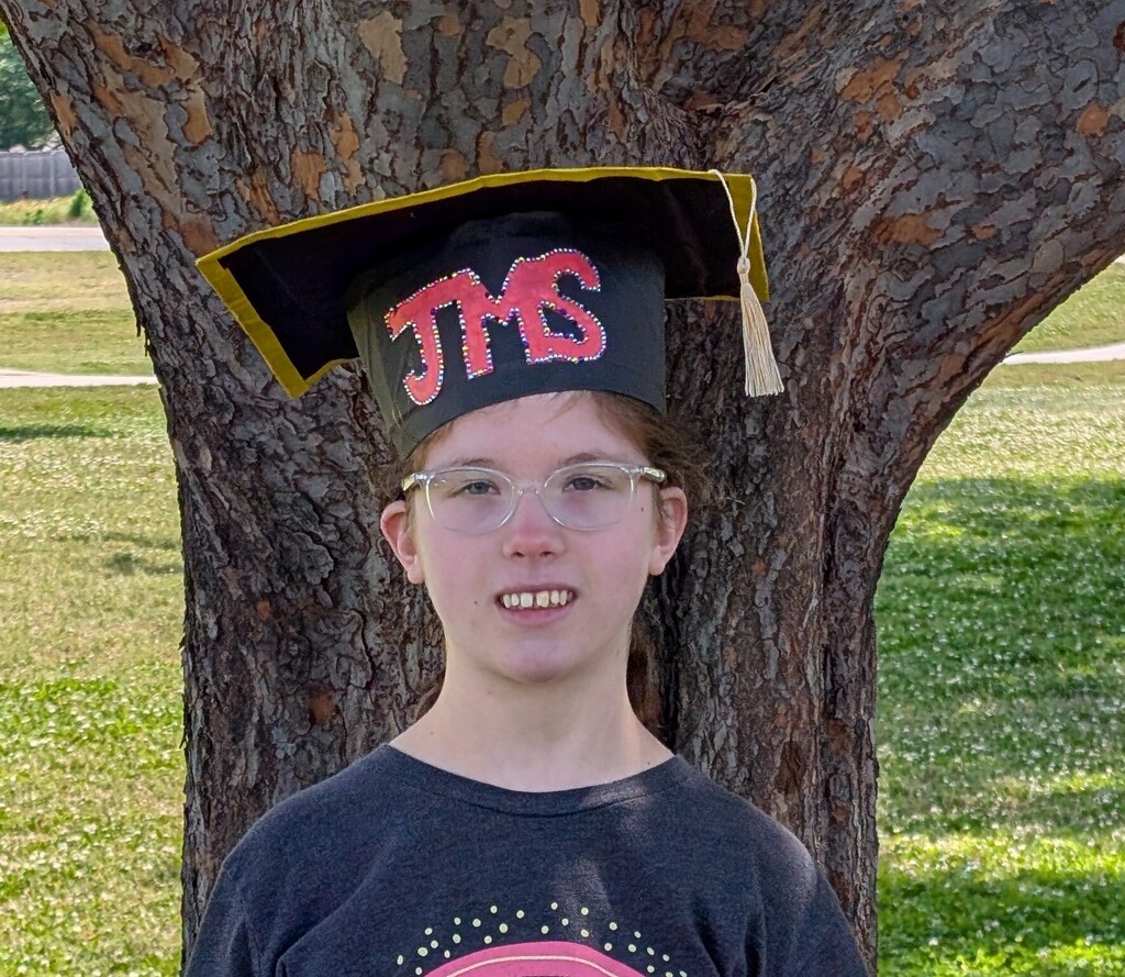 Student in JMS graduation cap