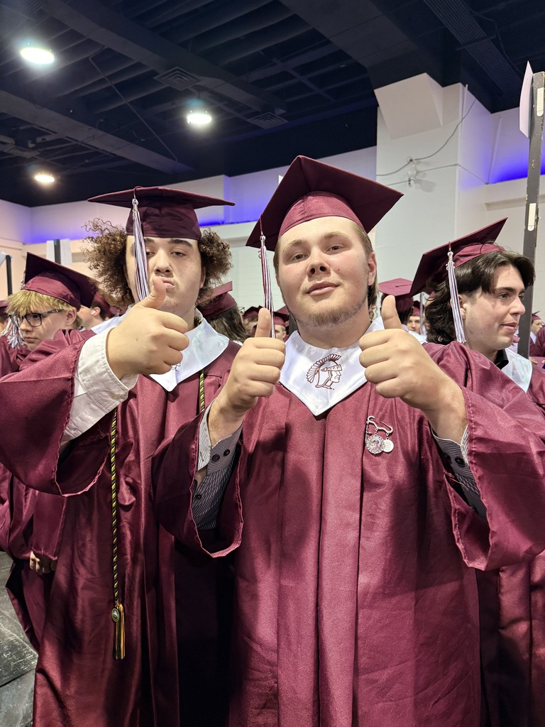 2 students giving thumbs up 