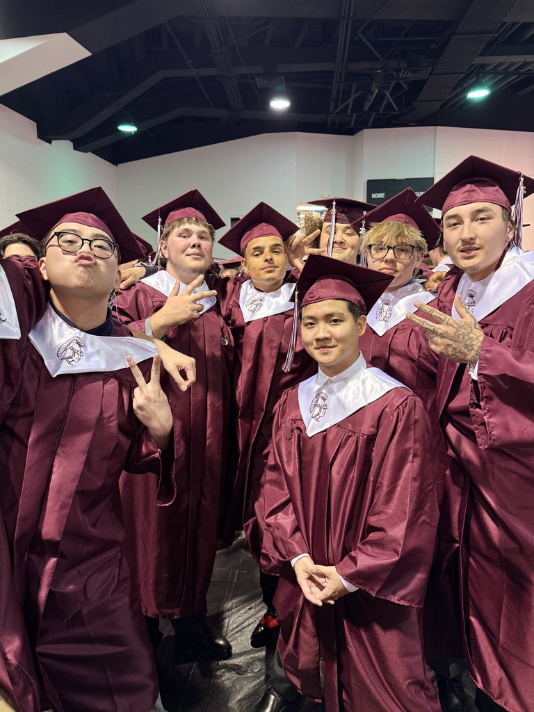 A group of young men in their graduation gowns