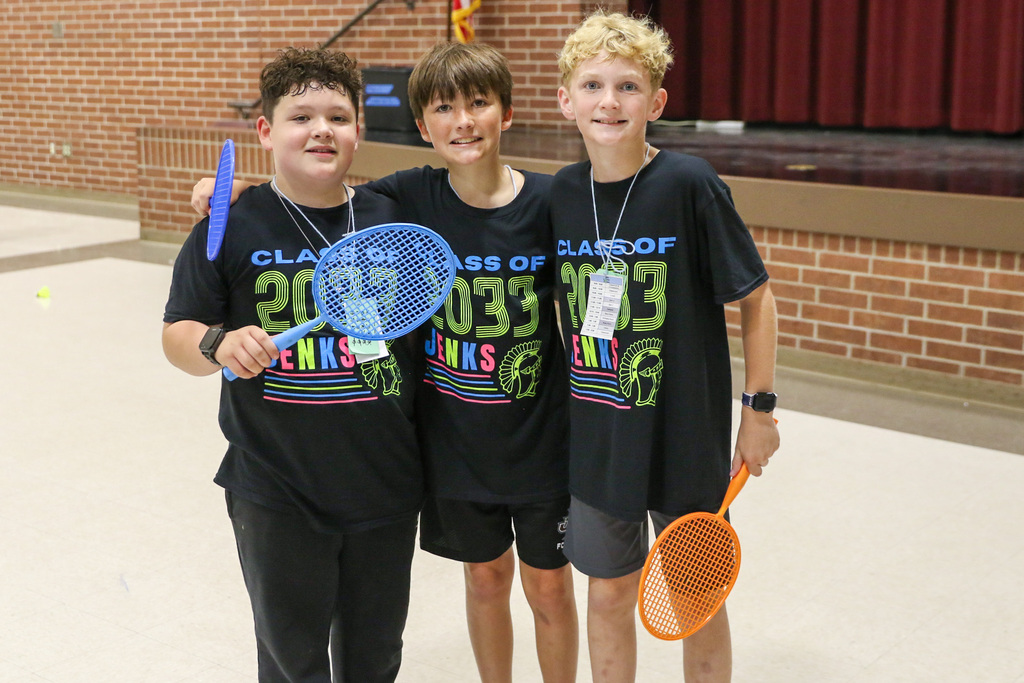 3 boys wearing the same shirt that says jenks class of 2033