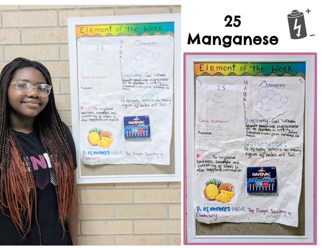 Student standing next to element poster